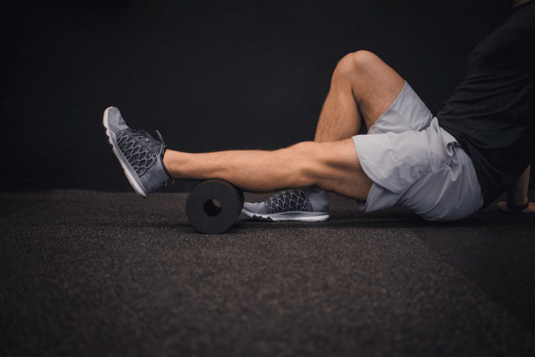 a man using a foam roller
